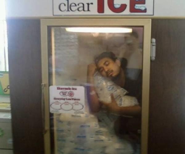 Man cooling off in ice fridge